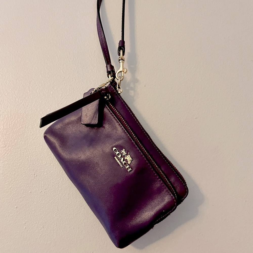Dark purple Coach clutch.